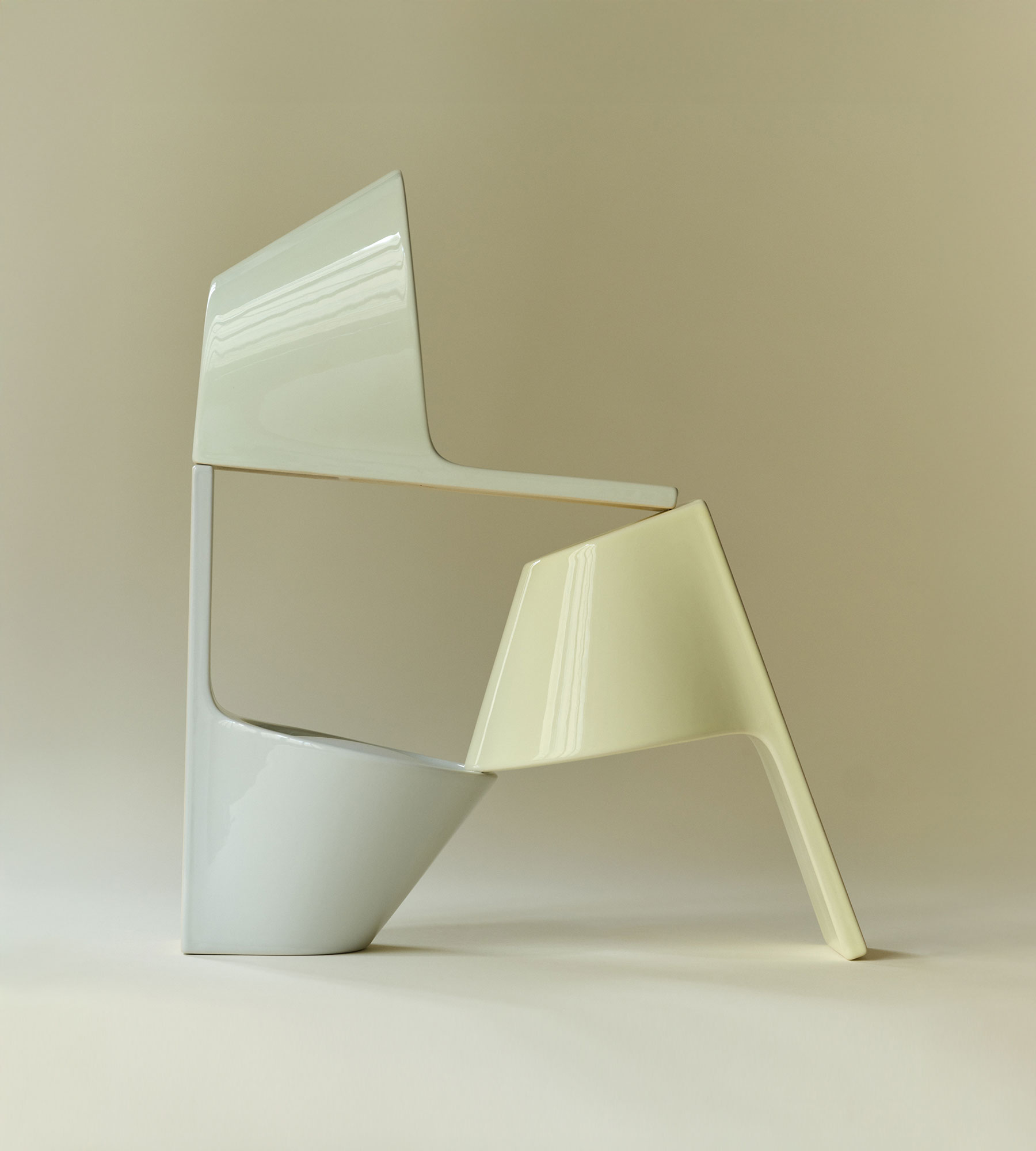 Three ceramic wall lamps forming a sophisticated sculpture.