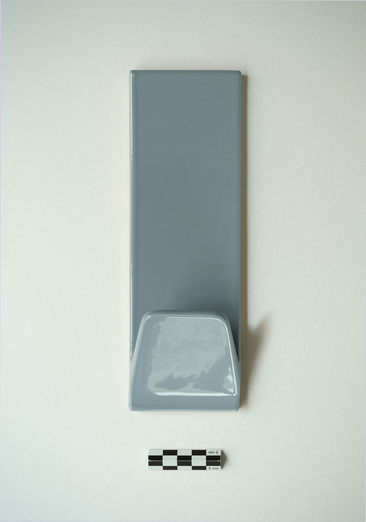 A blue gray ceramic hook packshot
